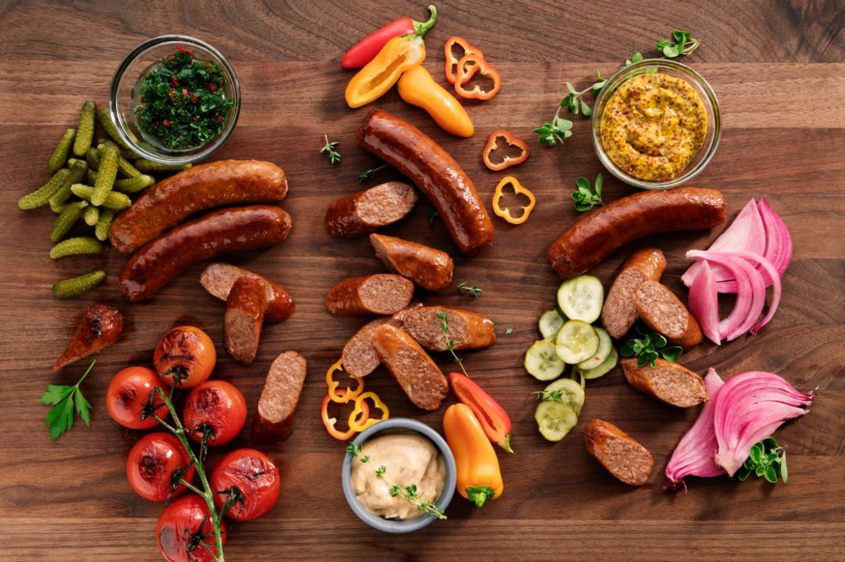 Beyond Sausage on a board with vegetables
